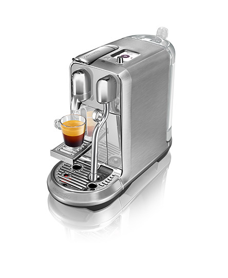 Nespresso OriginalLine machine with cup of espresso and latte.