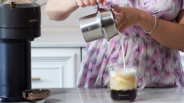 Milk being poured in to coffee from Nespresso Barista device