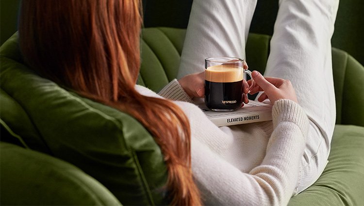Back to school 2022 promotion visual, woman reading book while drinking coffee