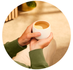 Woman unwrapping a Nespresso gift box