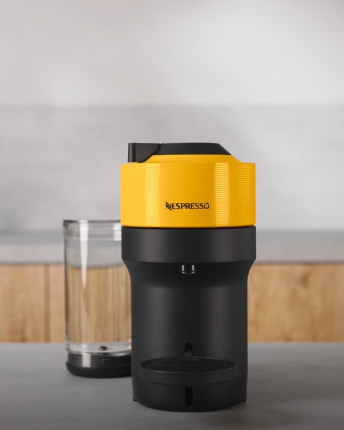 https://www.nespresso.com/shared_res/agility/global/machines/vl/image-and-text/vertuo-pop-plus-yellow_machine_4-5_primary_m_2x.jpg