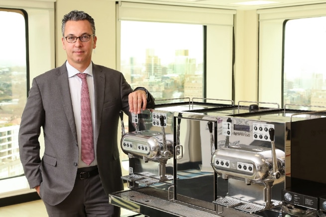 Loïc Réthoré, General Manager Nespresso Oceania making his morning coffee every morning on the Aguila 420 machine in the office kitchen