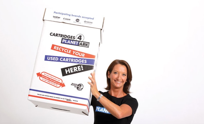 Layne Beachley with a printer cartridge recycling collection box
