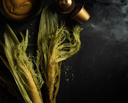 2 pieces of bbq corn beside volluto coffee capsules